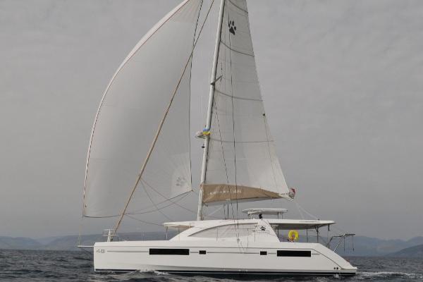 Leopard 48 2015 Leopard 48 catamaran sailing on open water with full sails.