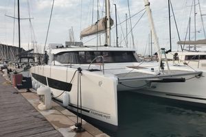 Fountaine Pajot 41 2025 Fountaine Pajot 41 catamaran docked at marina, showcasing sleek design and modern features.