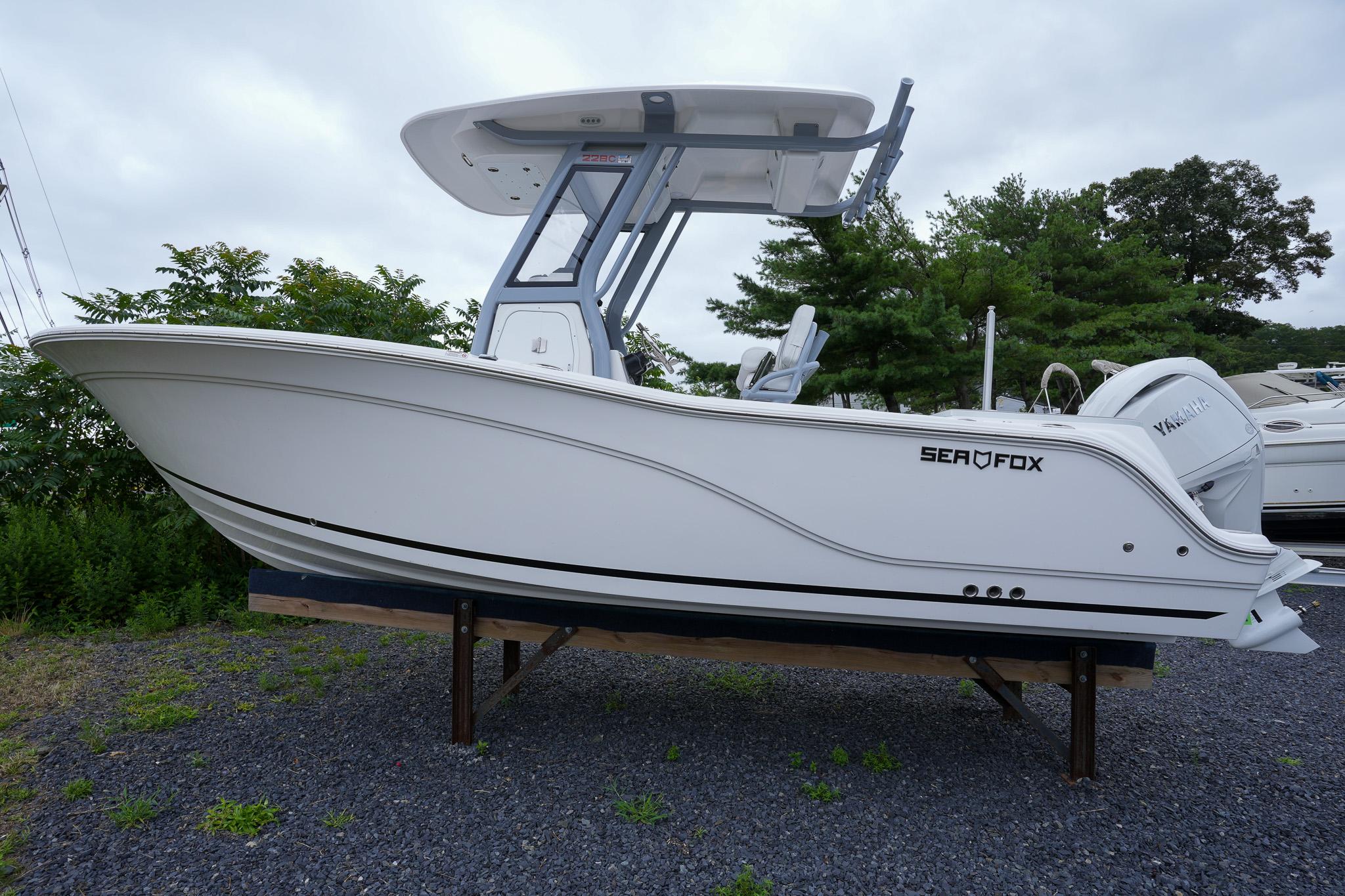 Sea Fox 228 Commander 2026 Sea Fox 228 Commander boat displayed outdoors on gravel.
