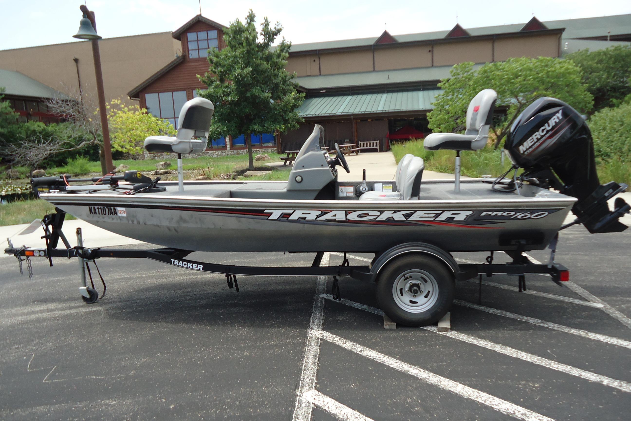 Tracker PRO160 2017 Tracker PRO160 fishing boat on trailer, parked outdoors.