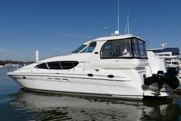 Sea Ray 480 Motor Yacht 2002 Sea Ray 480 Motor Yacht docked on calm water under clear blue sky.