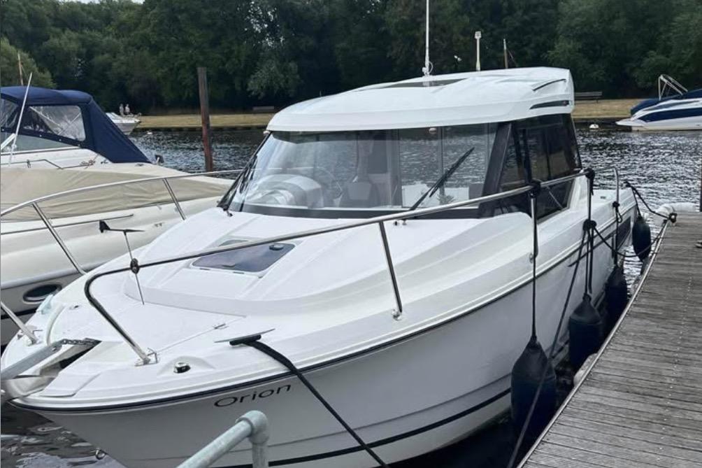 Jeanneau Merry Fisher 795 2019 Jeanneau Merry Fisher 795 boat docked by the river.