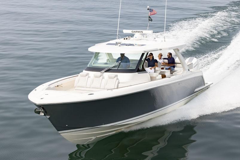 Tiara Yachts 43 LS 2024 Tiara Yachts 43 LS cruising on open water with passengers onboard.