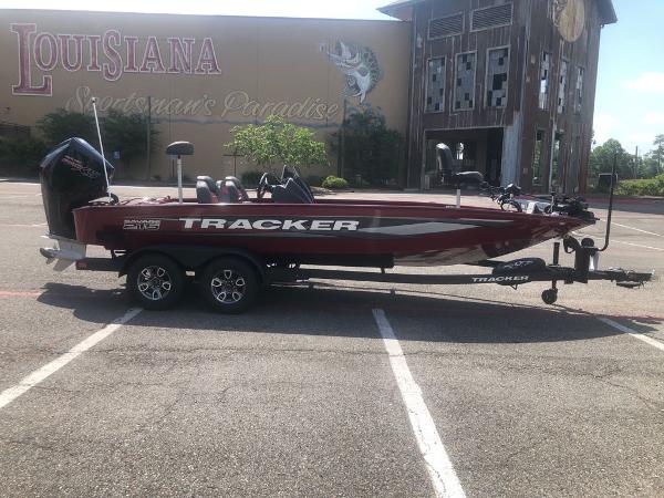 Tracker Savage 215 2025 Tracker Savage 215 boat on trailer, parked outside Louisiana Sportsman's Paradise.