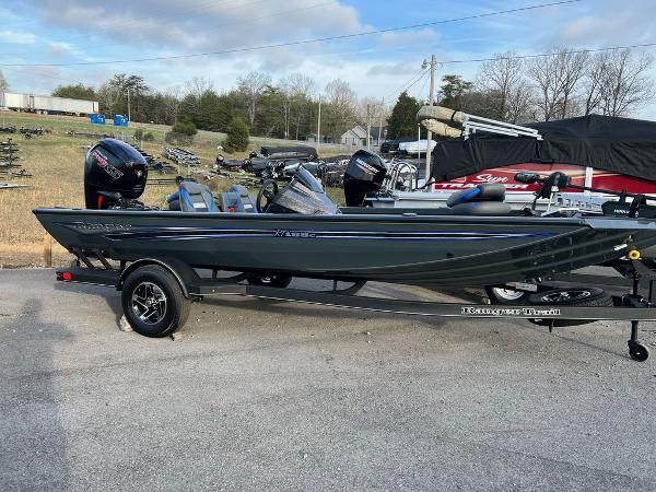 Ranger RT188C 2023 Ranger RT188C fishing boat on trailer, parked outdoors.