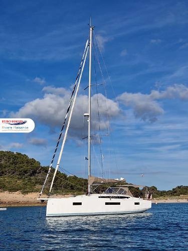 Jeanneau Sun Odyssey 410 2020 Jeanneau Sun Odyssey 410 sailboat on calm water, clear sky background.