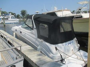 Sea Ray 280 Sundancer 2005 Sea Ray 280 Sundancer docked at marina with black canopy.