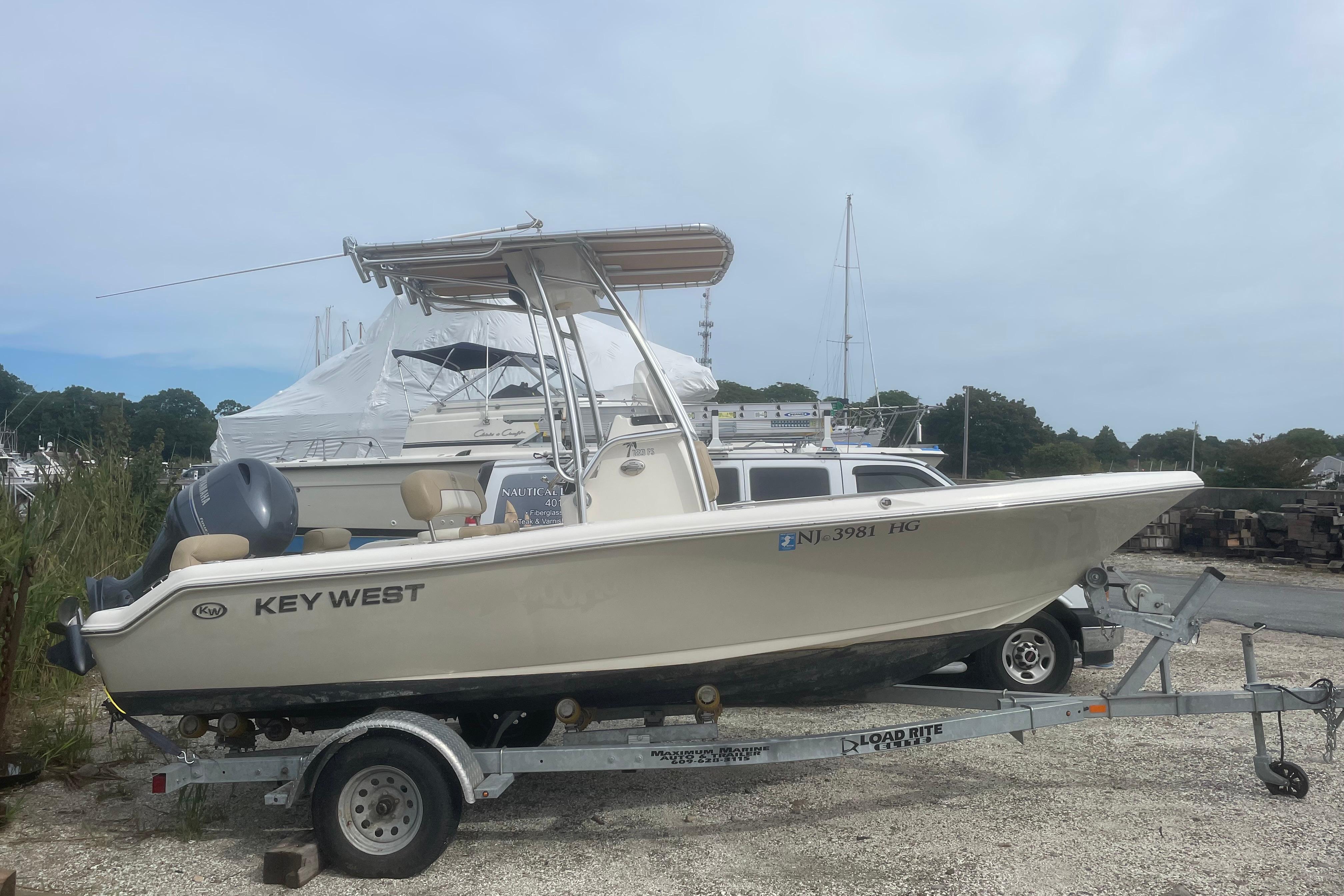 Key West 189 FS 2015 Key West 189 FS boat on trailer, parked outdoors.
