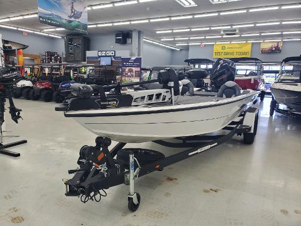 Vexus AVX2080 2024 Vexus AVX 2080 boat on display in a showroom.
