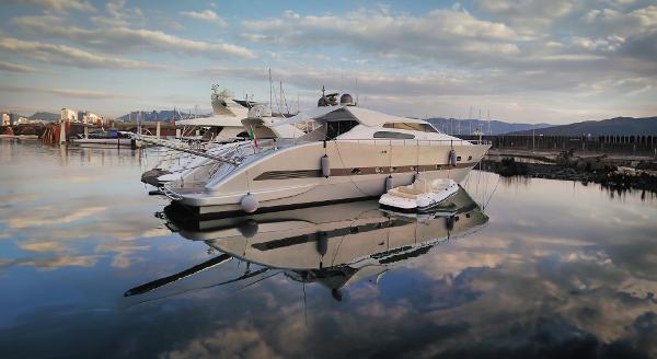 Tecnomar Velvet 83 Luxury yacht Tecnomar Velvet 83, 2006 model, docked in serene marina at sunset.