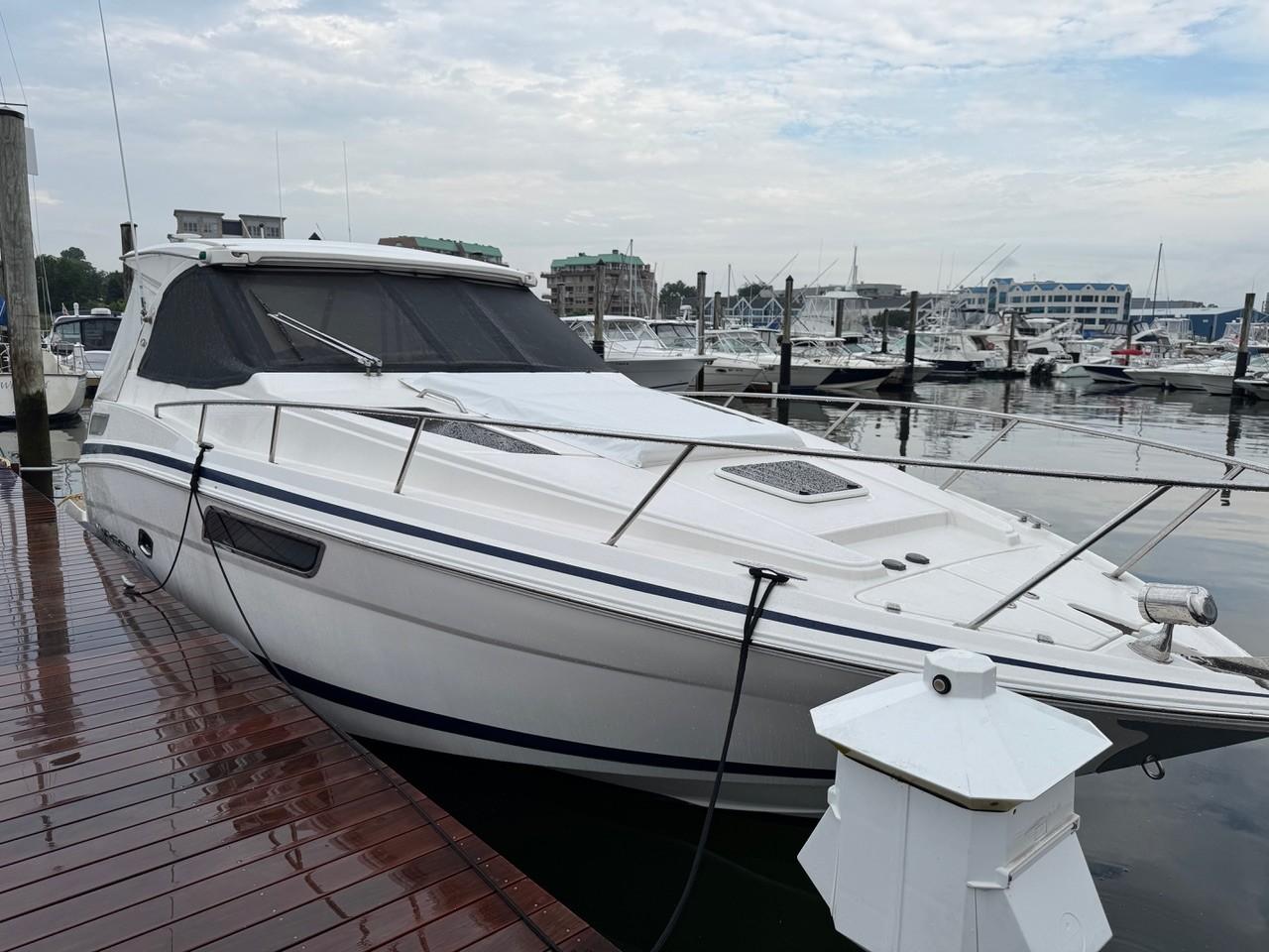 Regal 35 Sport Coupe 2016 Regal 35 Sport Coupe docked at a marina, overcast sky.