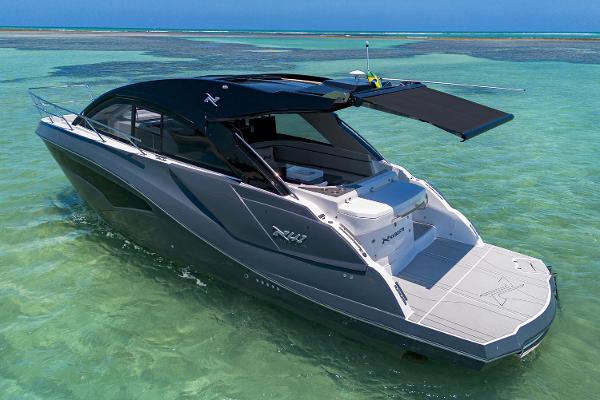 NX Boats 41 Horizon 2025 NX Boats 41 Horizon cruising in clear turquoise waters.