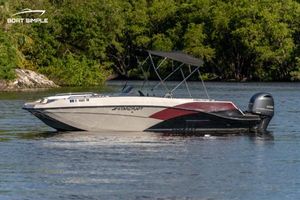 Starcraft SVX 231 OB DH 2023 Starcraft SVX 231 OB DH boat on a calm river with lush greenery.