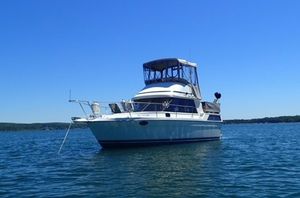 Cooper Prowler 9M 1988 Cooper Prowler 9M boat on calm blue water under clear sky.