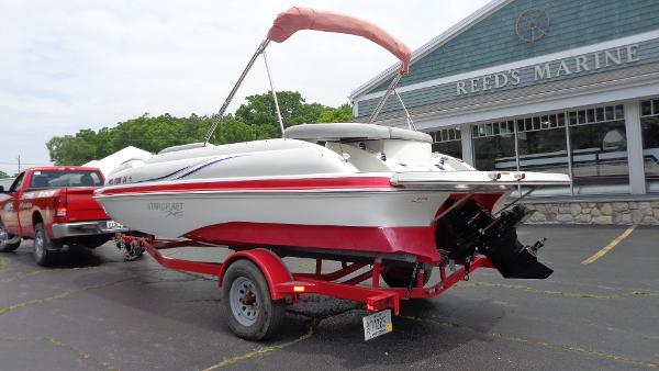 Starcraft Starstep 220 2014 Starcraft Starstep 220 boat on a red trailer outside Reed's Marine.