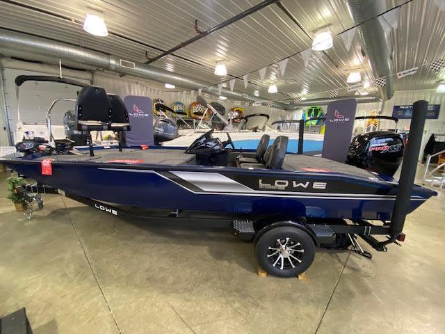 Lowe Stinger 188 Pro Series 2023 Lowe Stinger 188 Pro Series boat displayed indoors, showcasing sleek design and modern features.