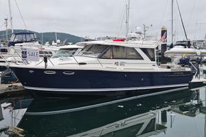 Cutwater C-32 Coupe 2020 Cutwater C-32 C boat docked, for sale, in a marina setting.