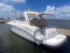 Sea Ray 360 Sundancer 2003 Sea Ray 360 Sundancer yacht docked at marina under blue sky.
