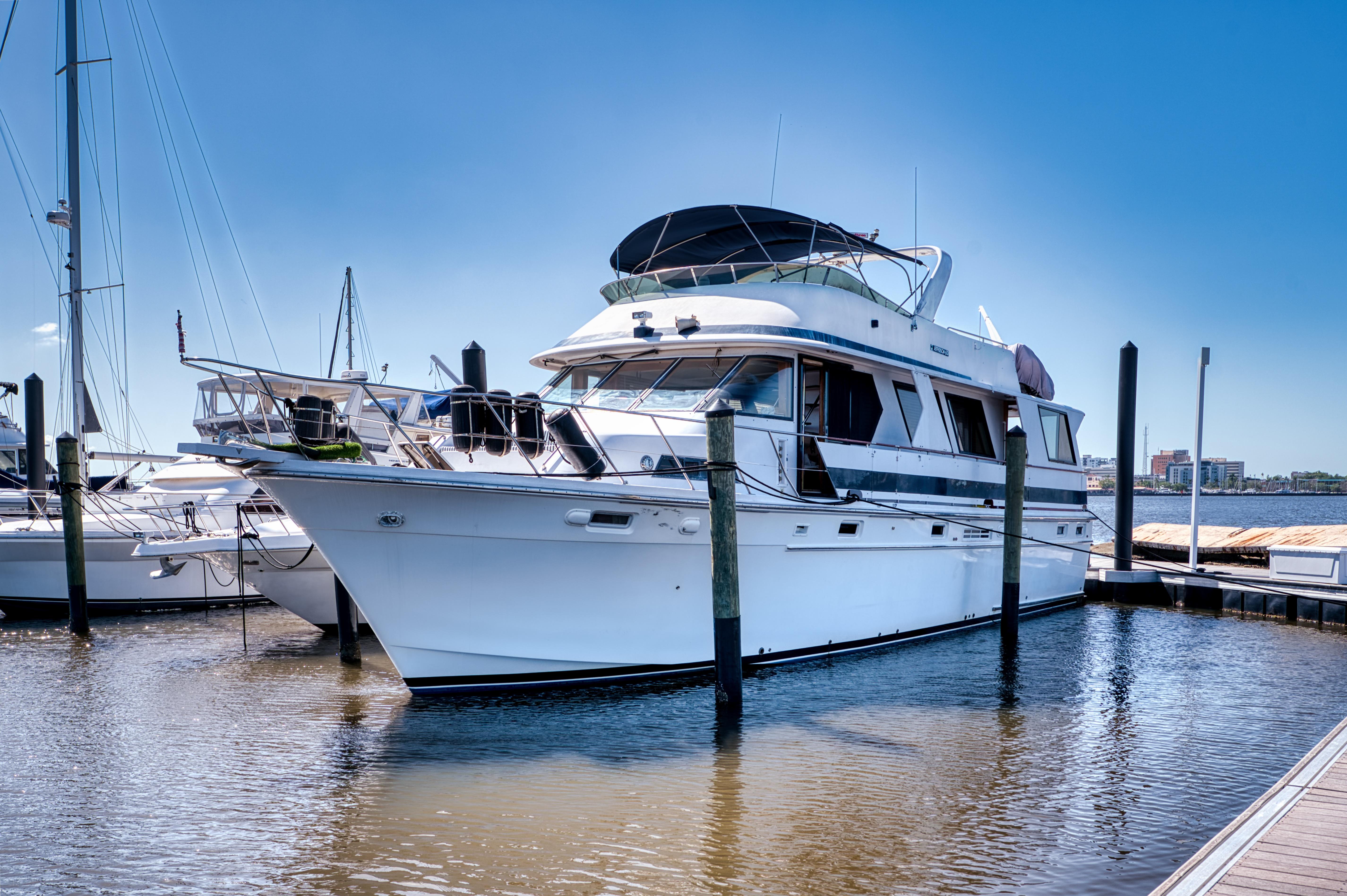 Jefferson 60 Motor Yacht 1987 Jefferson 60 Motor Yacht docked at marina under clear blue sky.