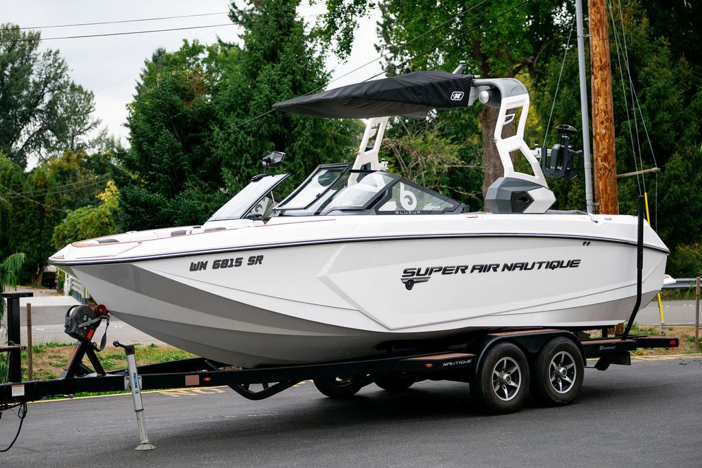 Nautique Super Air Nautique G23 2019 Nautique Super Air Nautique G23 boat on trailer, parked outdoors.