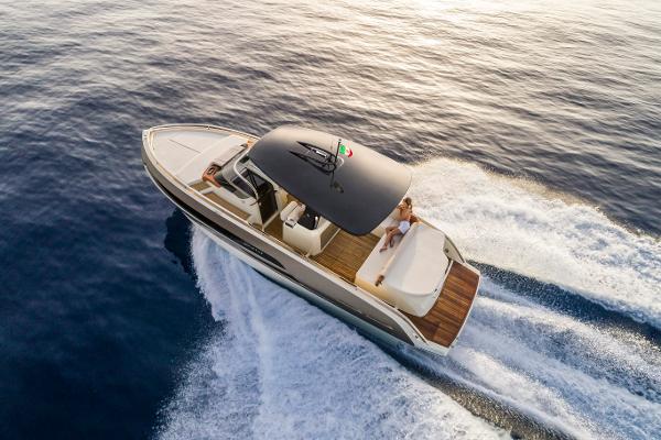 Invictus GT 320 Invictus GT 320 yacht cruising on open water, 2025 model, aerial view.