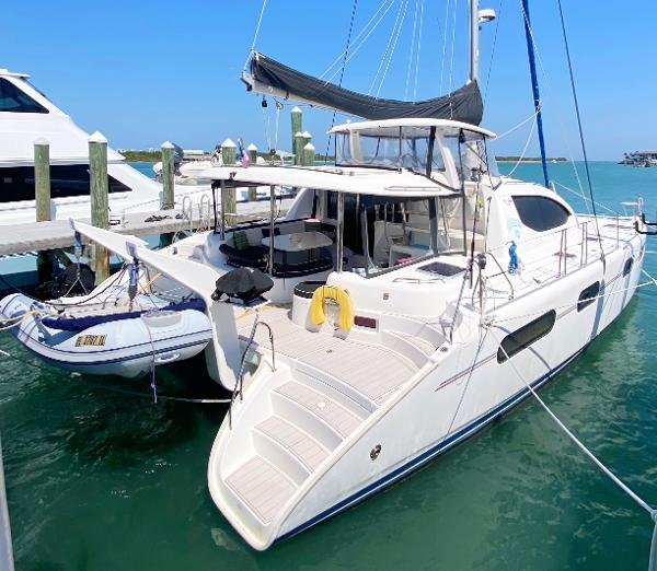 Leopard 46 Luxurious 2010 Leopard 46 catamaran docked in a sunny marina.