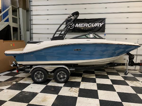Sea Ray SPX 190 2023 Sea Ray SPX 190 boat on trailer in showroom.
