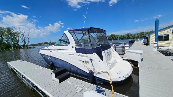 Rinker 350 Express Cruiser 2007 Rinker 350 Express Cruiser docked at a marina on a sunny day.