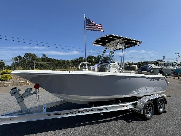 Key West 203 FS 2025 Key West 203 FS boat on trailer, American flag in background, sunny day.