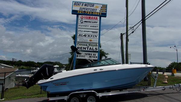 Monterey M 205 2025 Monterey M 205 boat on trailer at dealership with signage in background.