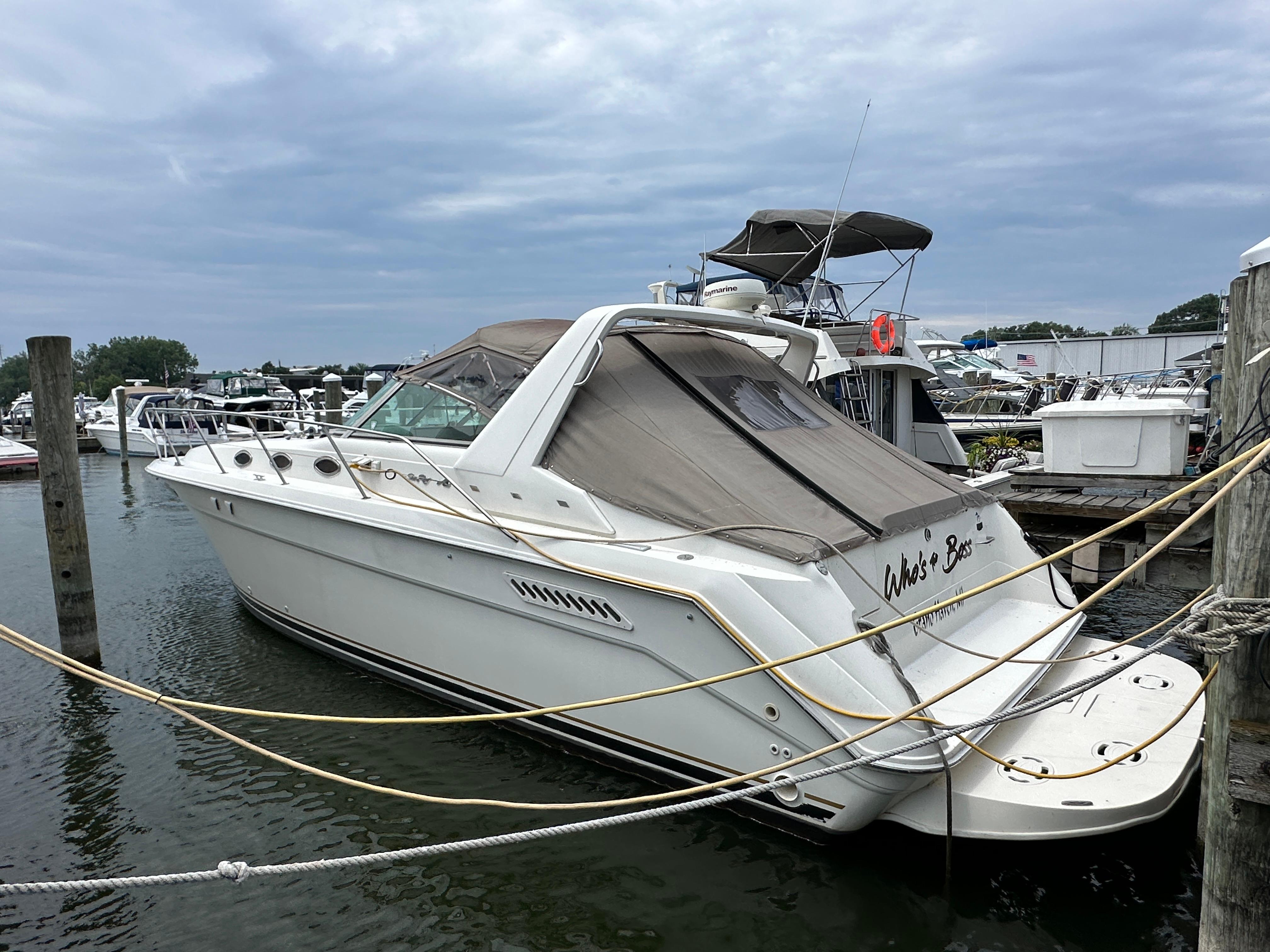 Sea Ray 370 Sundancer 1994 Sea Ray 370 Sundancer yacht docked at marina under cloudy sky.
