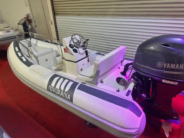 Novurania 360 DL 2021 Novurania 360 DL inflatable boat with Yamaha outboard motor on display.