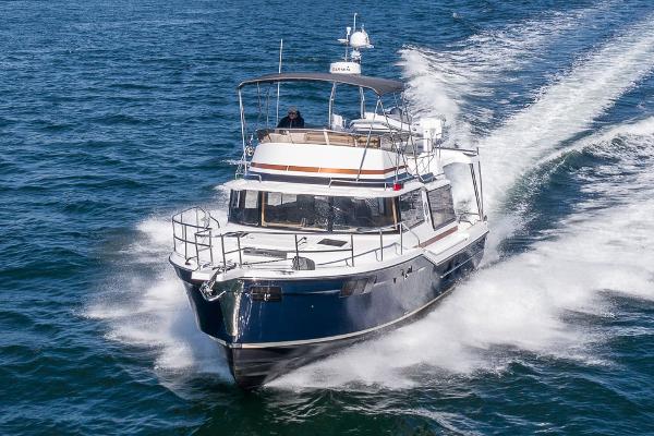 Ranger Tugs R-43 CB Manufacturer Provided Image: 2025 Ranger Tugs R-43 CB cruising on open water, showcasing sleek design and performance.