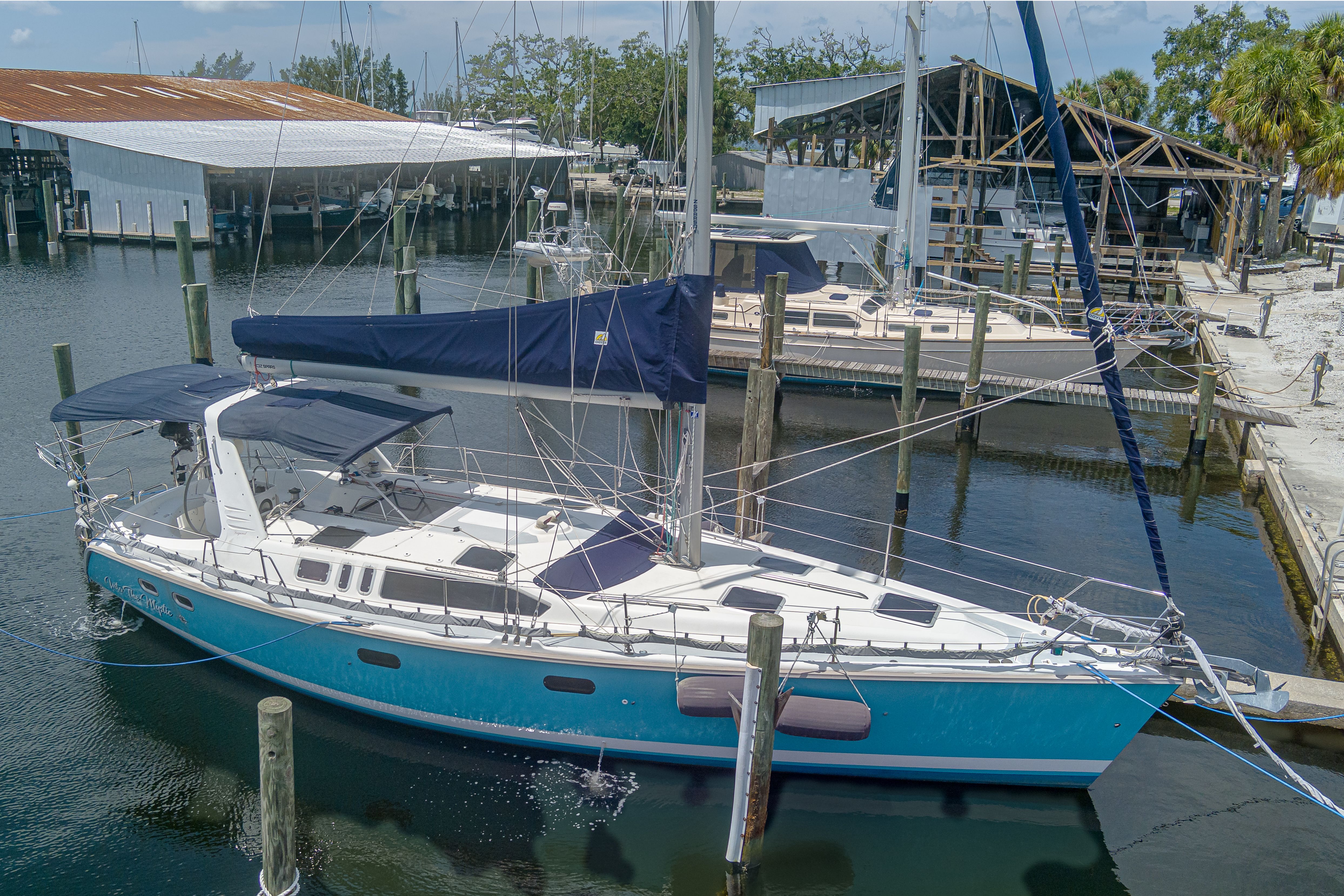 Hunter 430 Hunter 430 sailboat, 1996 model, docked at a marina with blue hull and white deck.
