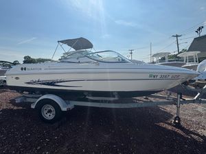 Glastron SX 195 2003 Glastron SX 195 boat on trailer, side view, sunny day.