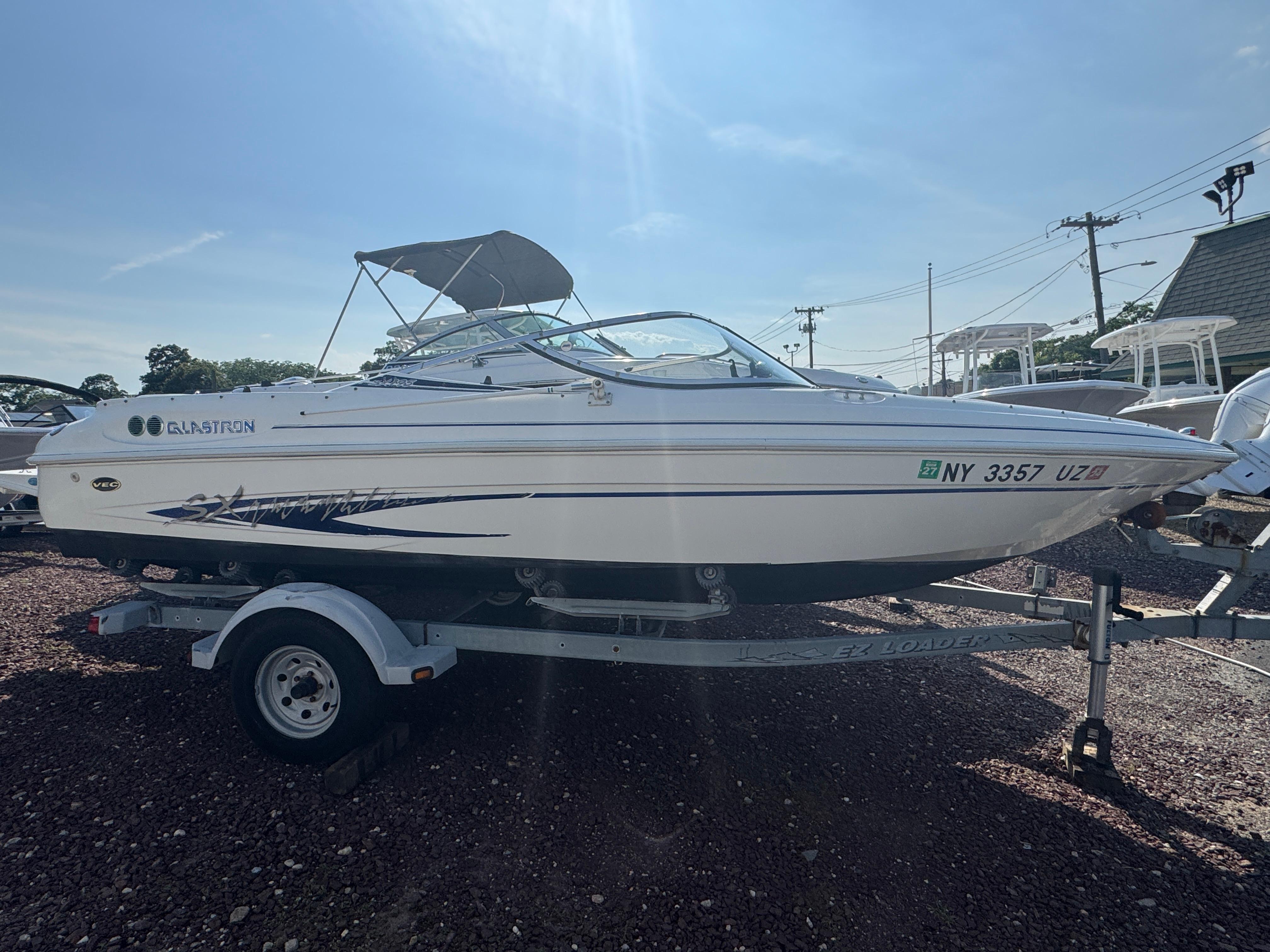 Glastron SX 195 2003 Glastron SX 195 boat on trailer, side view, sunny day.