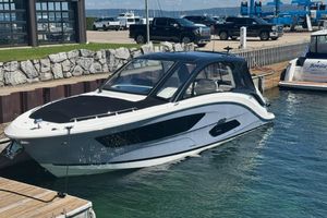 Sea Ray Sundancer 370 Outboard 2023 Sea Ray Sundancer 370 Outboard docked at marina, sleek design, sunny day.