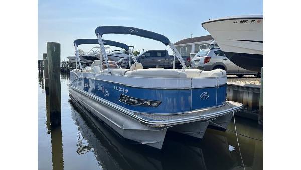 Avalon 2785 ENT 2021 Avalon 2785 ENT pontoon boat docked in marina.