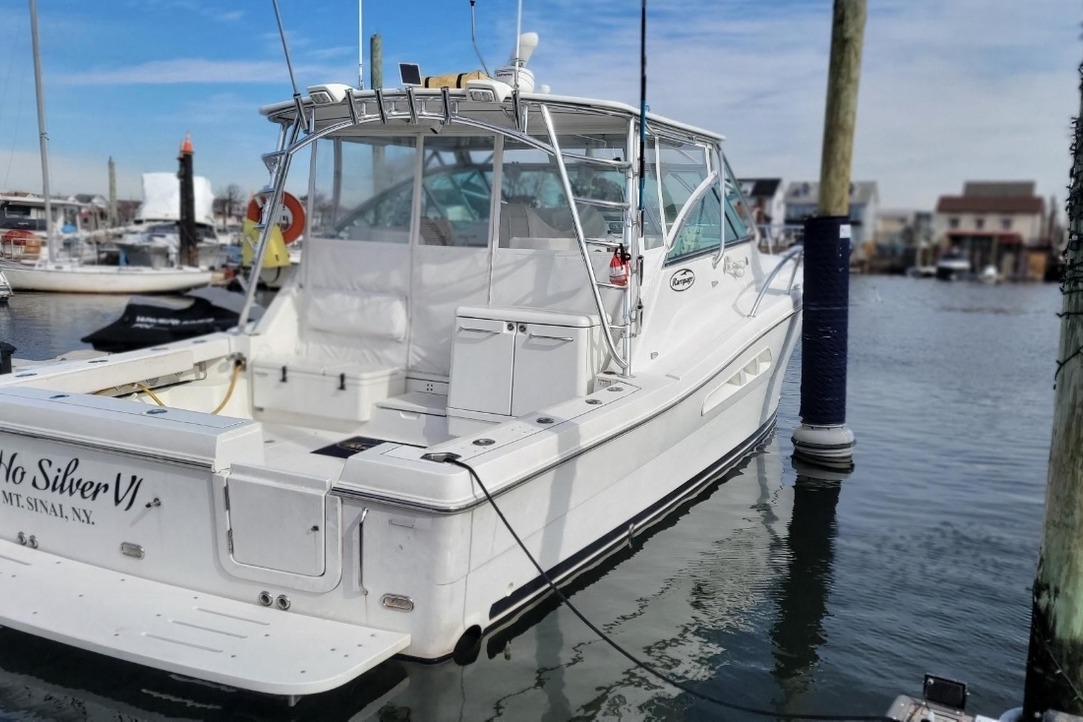 Rampage 41 Express 2011 Rampage 41 Express boat docked in marina, rear view, clear sky.