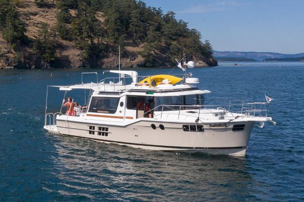 Ranger Tugs R-43 S Manufacturer Provided Image: 2025 Ranger Tugs R-43 S yacht cruising in scenic coastal waters.