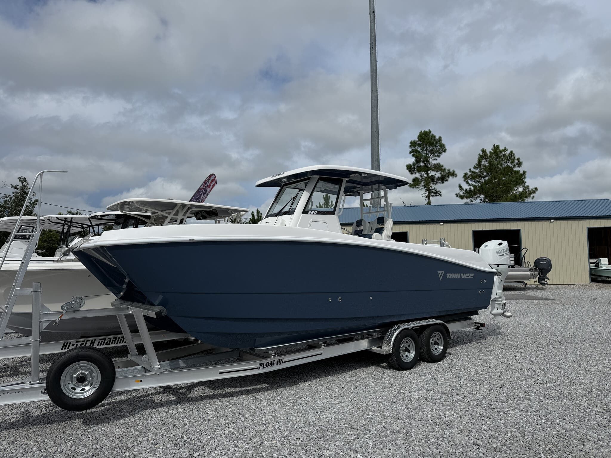 Twin Vee GFX2 260 GFX2 2026 Twin Vee GFX2 260 boat on trailer, parked outdoors.