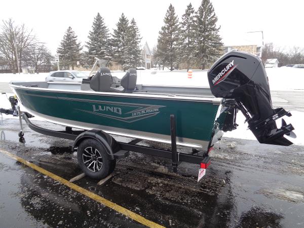Lund 1875 Alaskan SS 2025 Lund 1875 Alaskan SS boat on trailer, parked in snowy area.