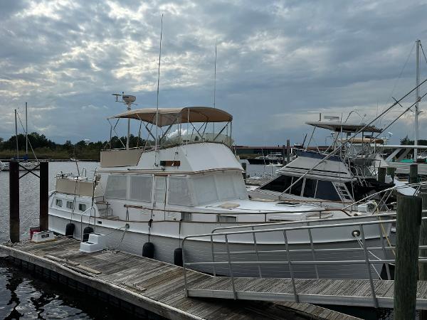 Grand Banks 42 Motor Yacht 1989 Grand Banks 42 Motor Yacht docked at marina under cloudy sky.