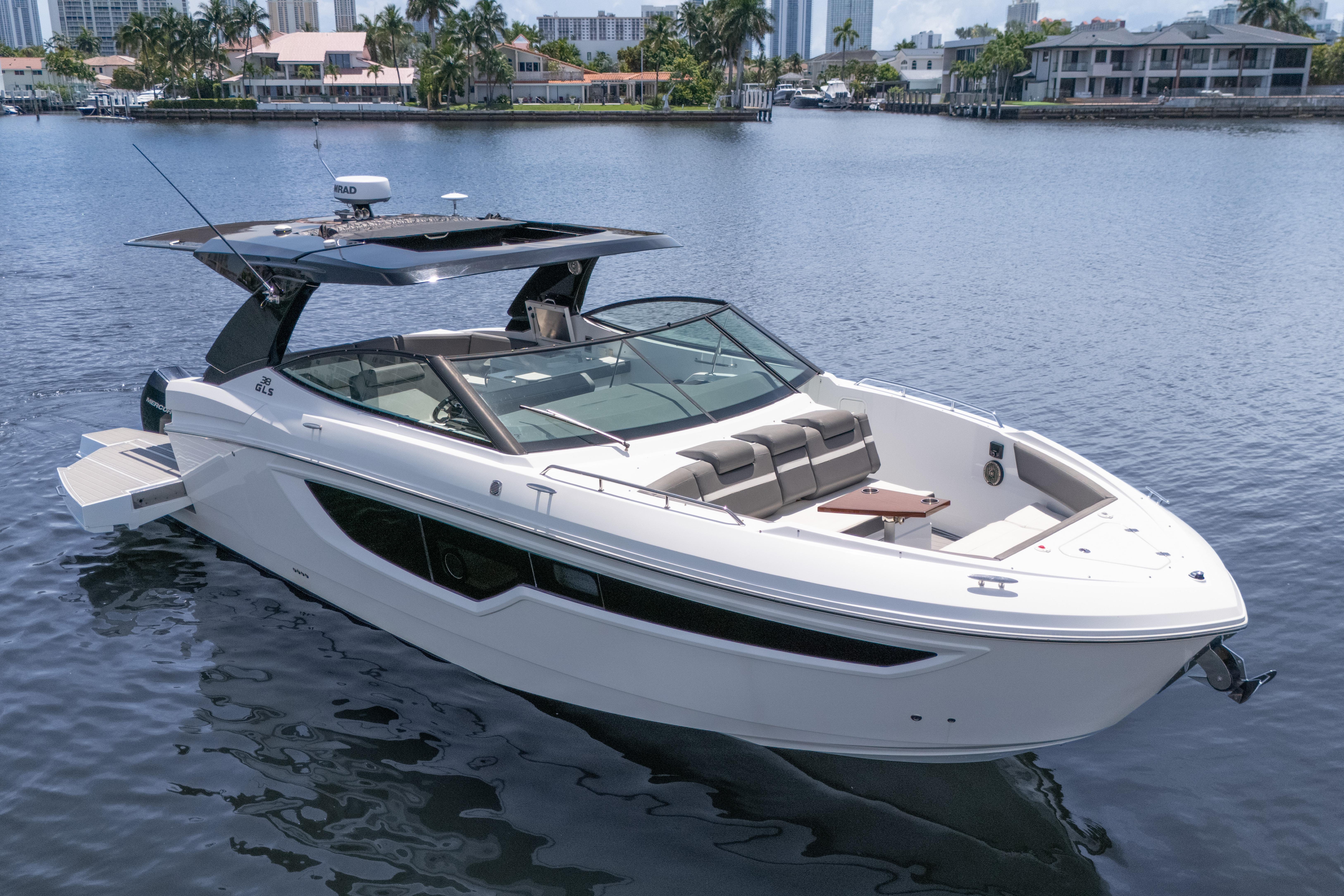 Cruisers Yachts 38 GLS 2021 Cruisers Yachts 38 GLS boat on calm water, featuring sleek design and spacious seating.
