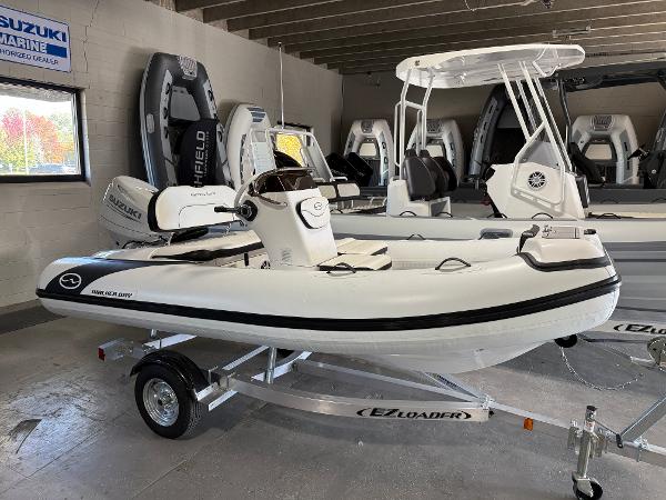 Walker Bay Generation 13 LTE 2025 Walker Bay Generation 13 LTE boat on trailer in showroom.