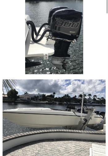 Powerplay Powerboats 33 Sportfish 1996 Powerplay Powerboats 33 Sportfish with powerful outboard motor, docked by waterfront.