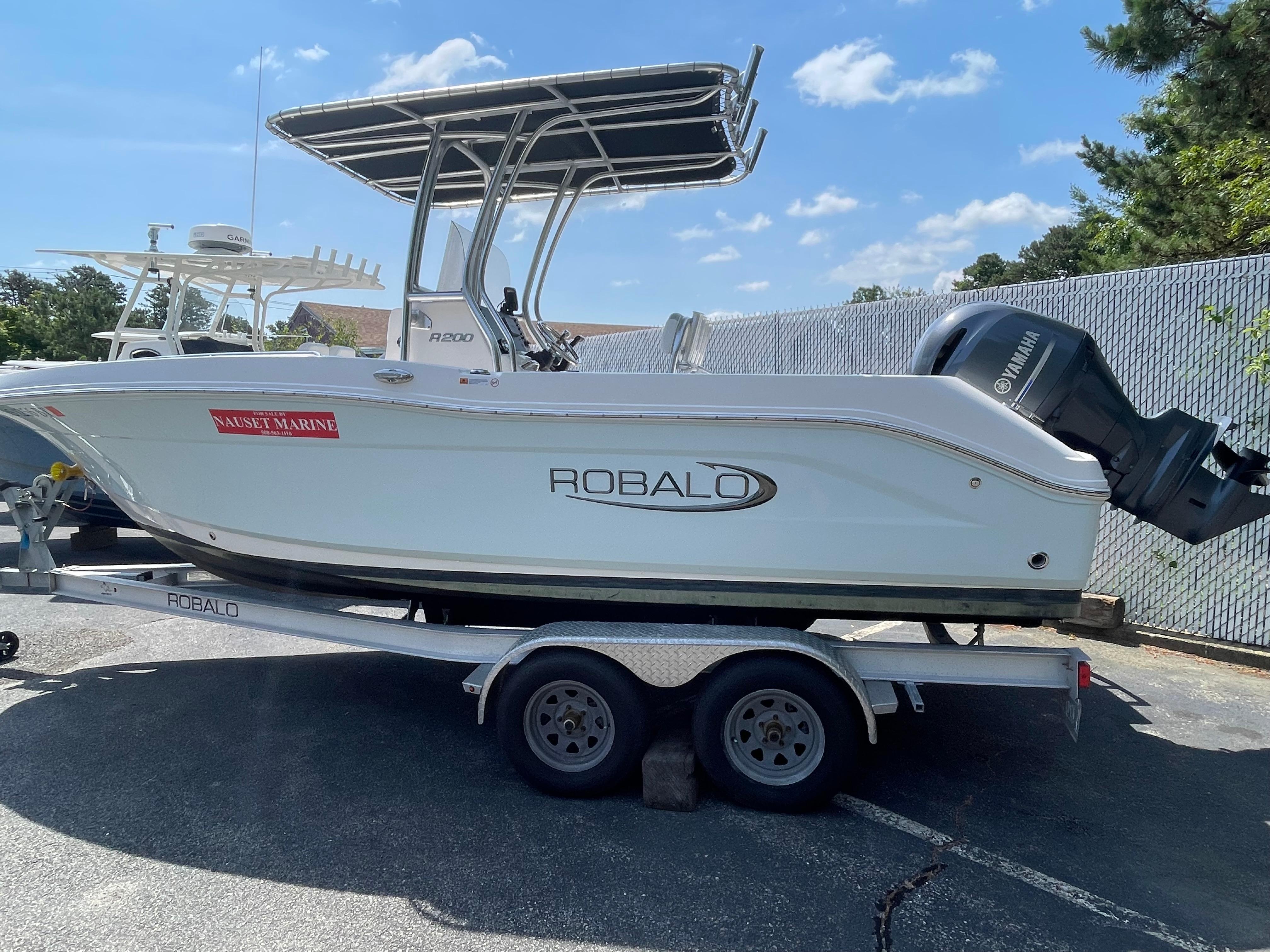 Robalo R200 Center Console 2022 Robalo R200 Center Console boat on trailer, sunny day.
