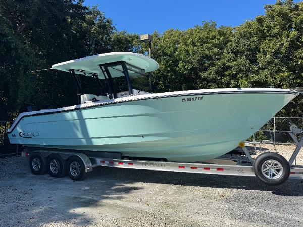Robalo R302 Center Console 2024 Robalo R302 Center Console boat on trailer, parked outdoors.