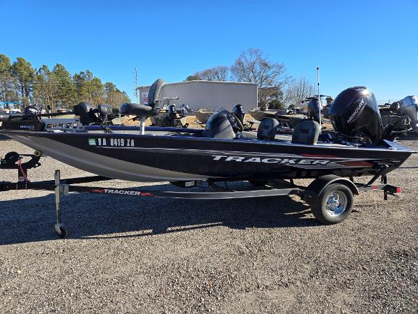Tracker Pro Team 175 TF 2021 Tracker Pro Team 175 TF boat on trailer, parked outdoors.