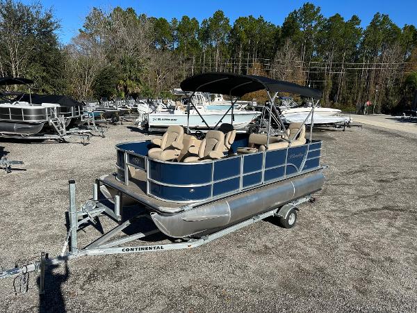 Bentley Pontoons 180 2024 Bentley Pontoons 180 on trailer, parked outdoors with other boats in the background.